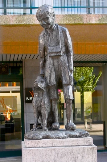 there is a statue of a man and a dog