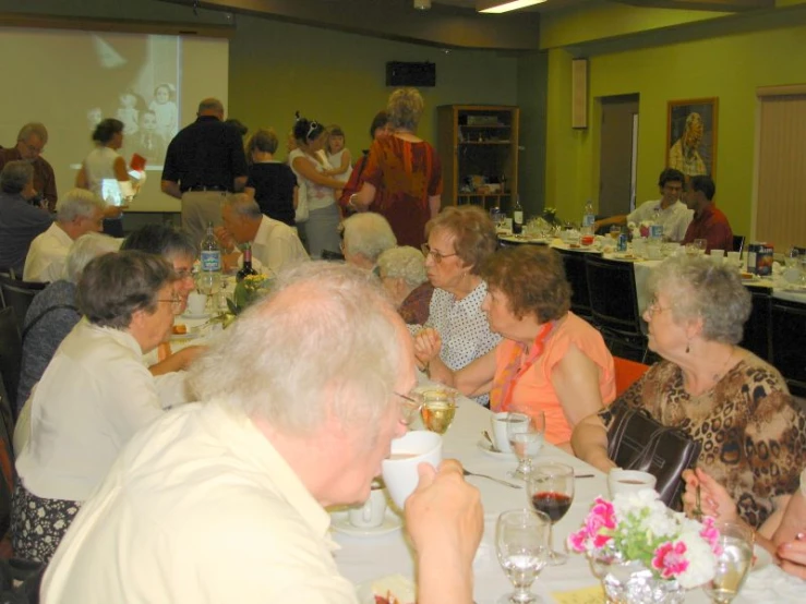 older people at a banquet eating and drinking