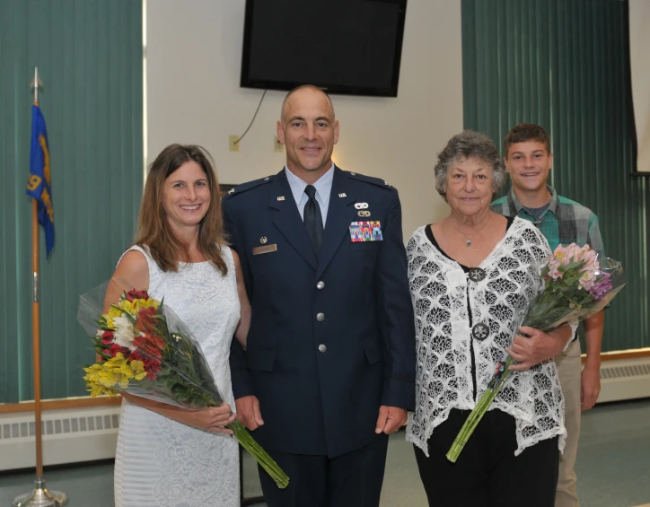 the three people are dressed in military uniforms