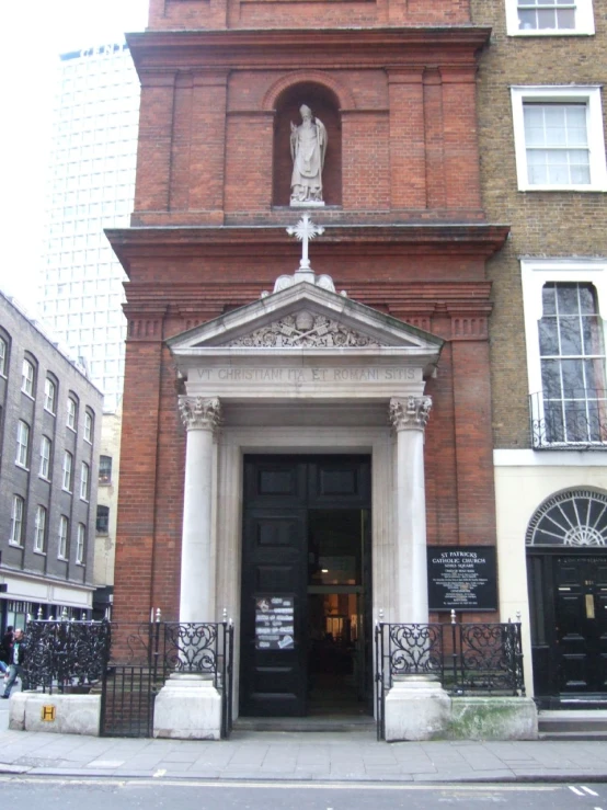 the entrance to a building with a clock tower