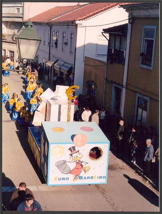 several float in street parade with sunflowers and other decorations