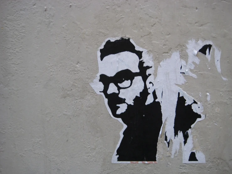 a sticker of a man with sunglasses is in a shadow