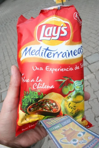 a bag of lays mediterranean food with some chili sauce