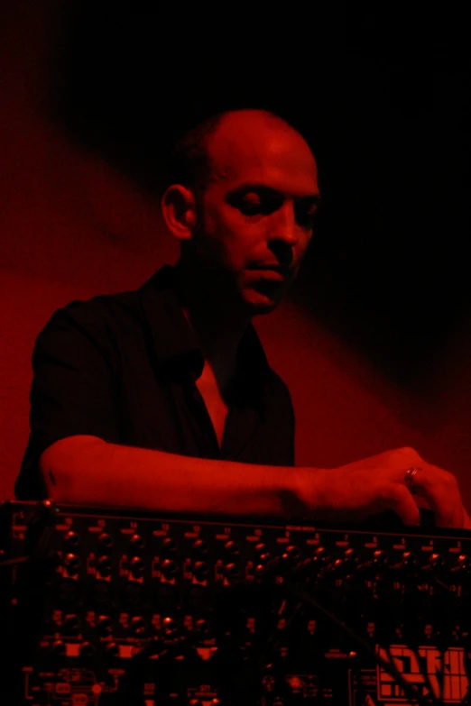 a man with a black shirt and red light