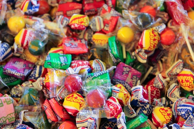 colorful candies are lined up on display