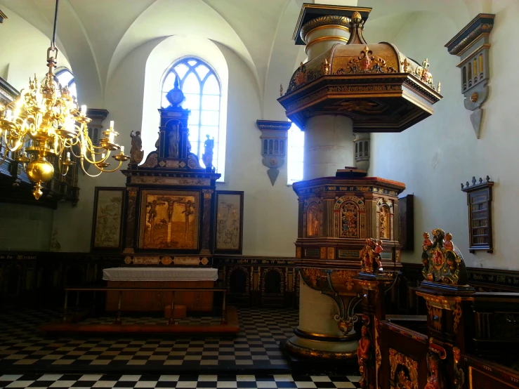 the inside of a building with several large and old wooden pieces