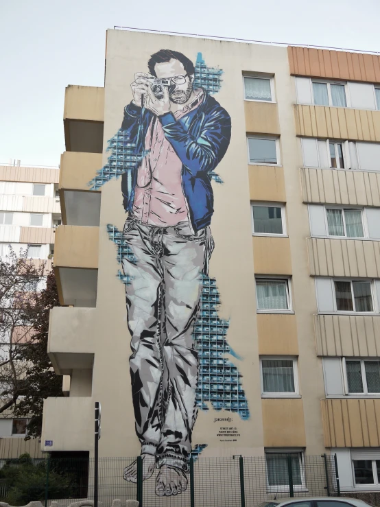 large colorfully colored mural painted on the side of a building