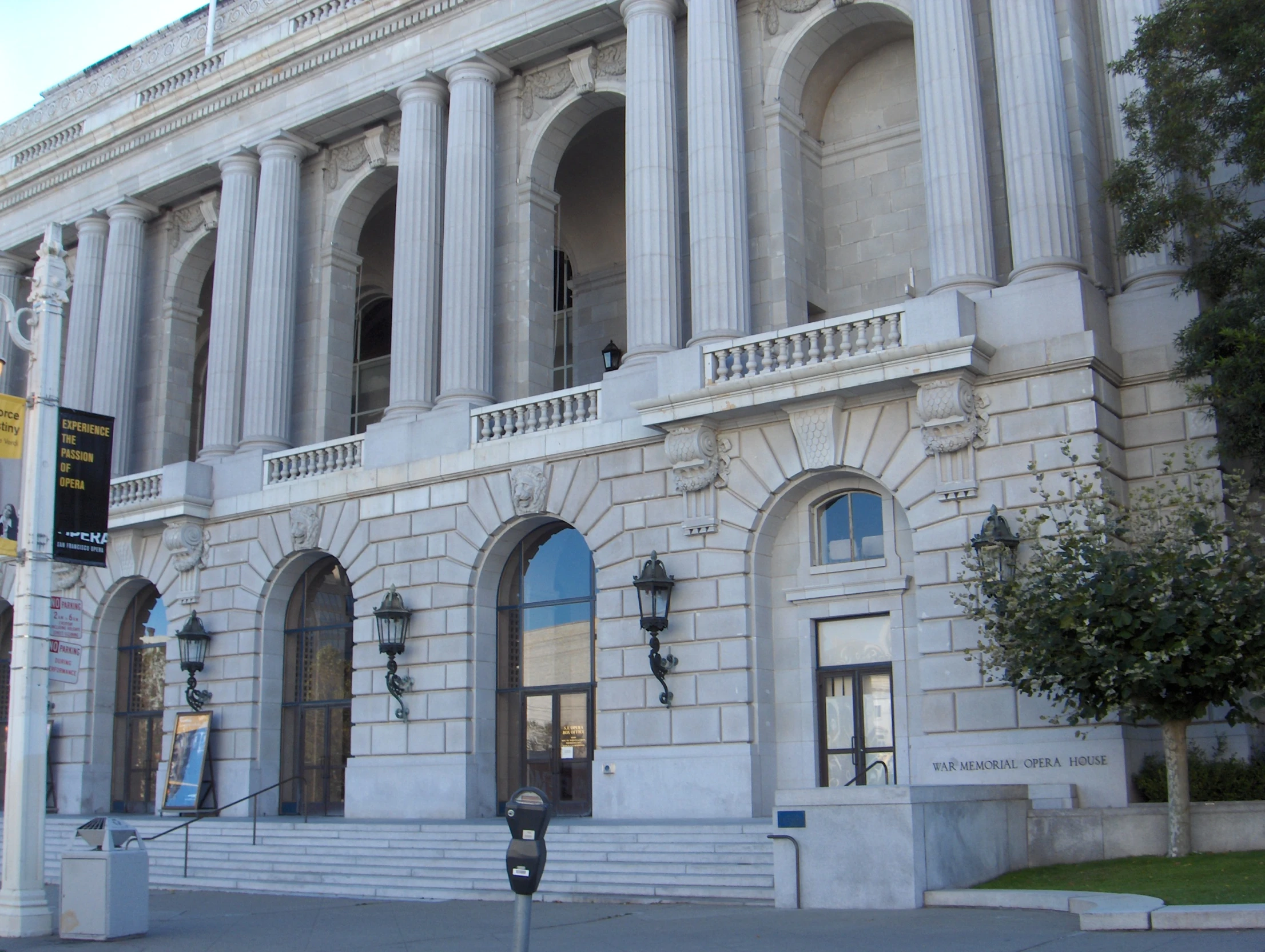 a tall building with columns and two windows