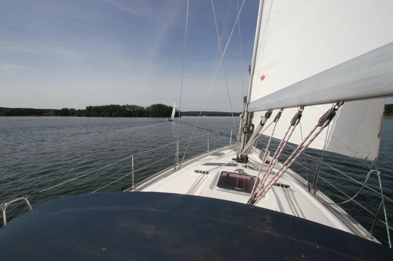 an sailboat sits at full speed in the water