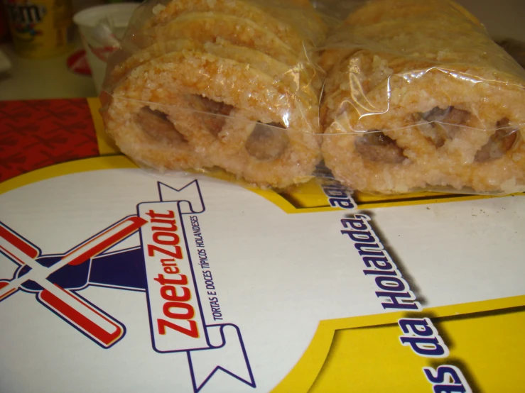 a close up of a doughnut wrapped in plastic