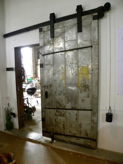 a dirty old door in an empty room