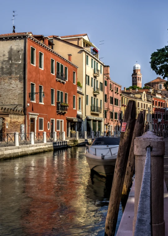 some very pretty old buildings on the side of a river