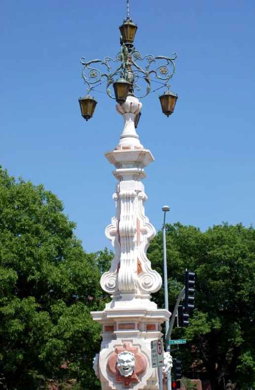 a light tower is adorned with a fancy head