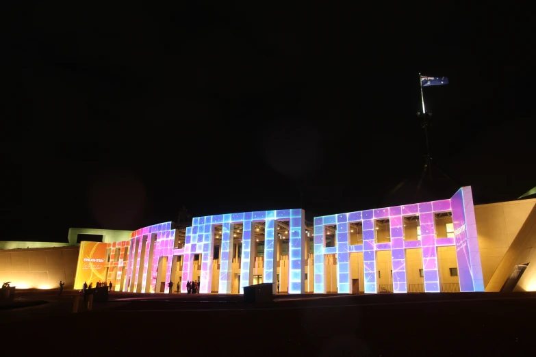 the building has several colorful lights on it