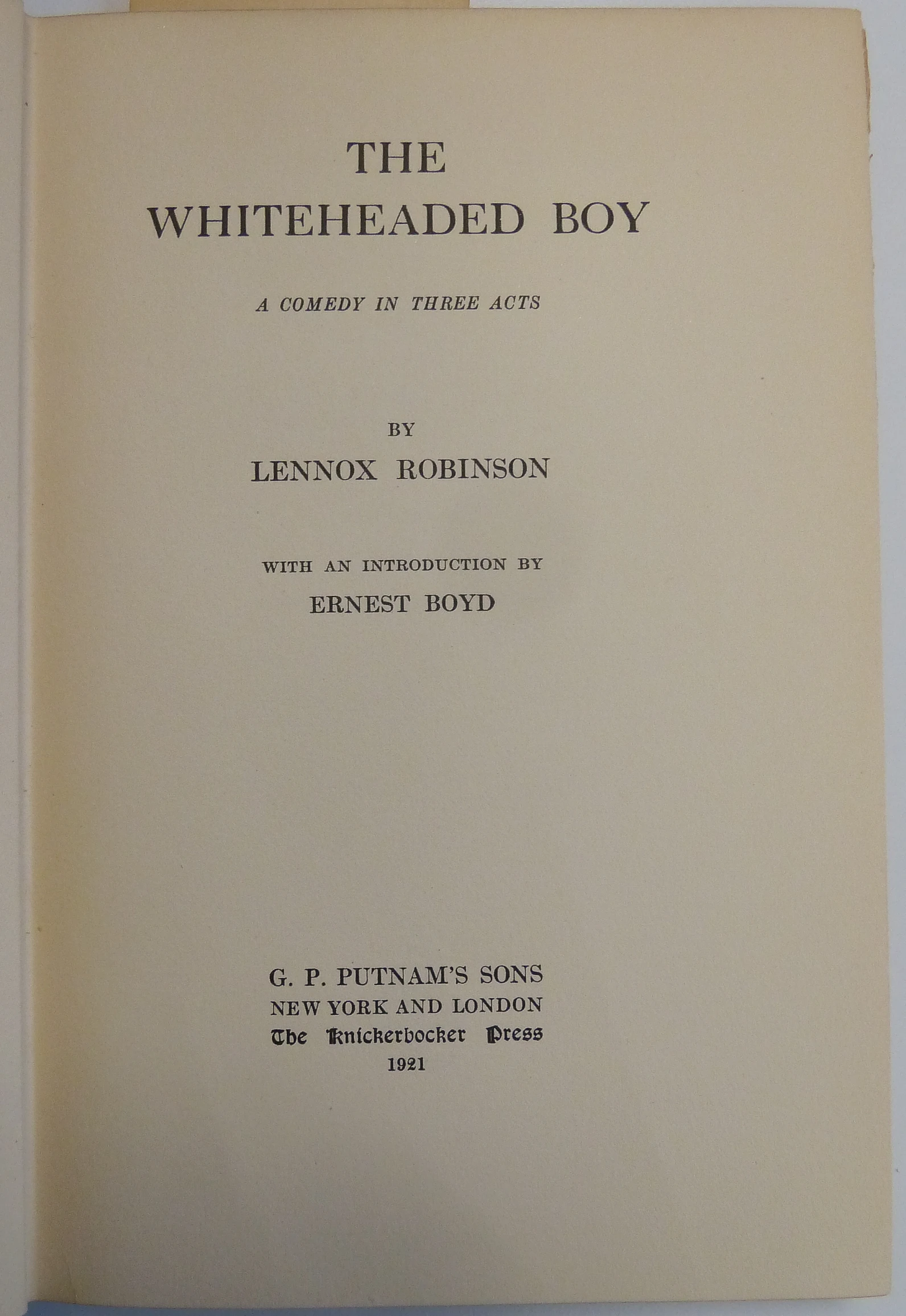 an open book with a picture of a boy holding soing