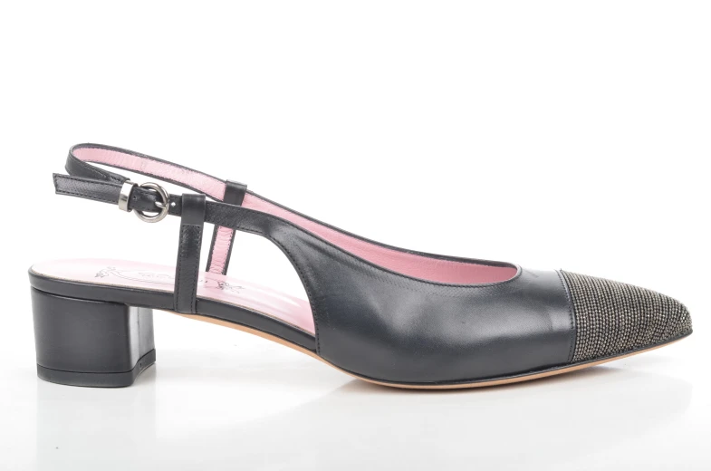 black, shiny heeled shoes with a silver metal band and black leather platform