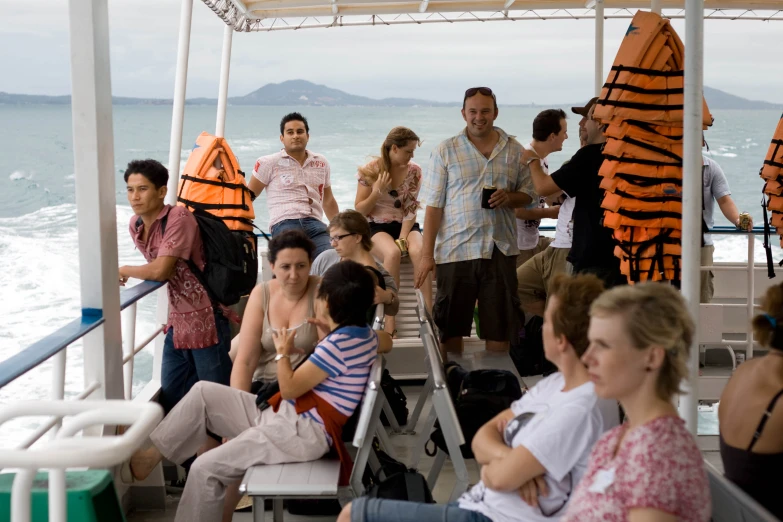 a group of people on the deck of a boat