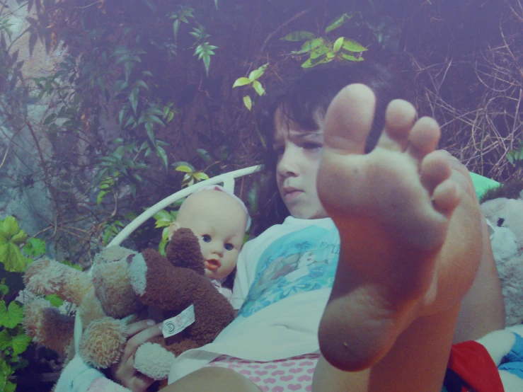 a child laying in bed with her  out