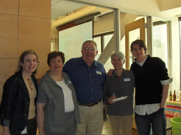 a group of people standing and posing for a po