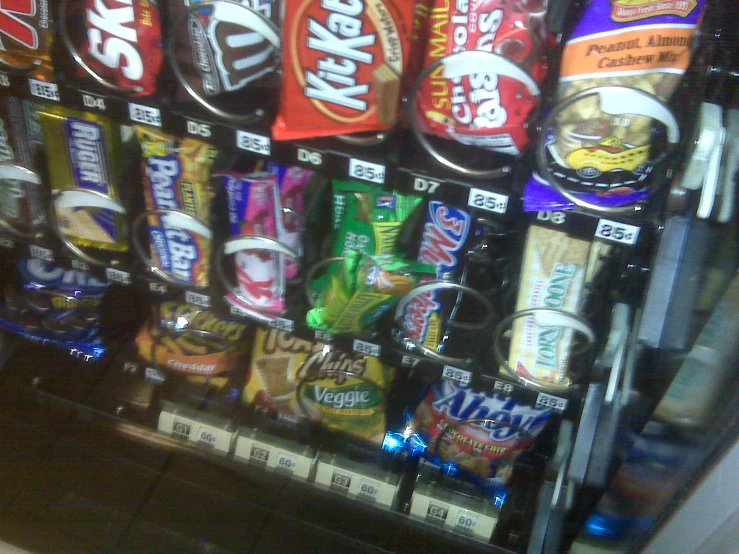 a vending machine with snacks displayed in it