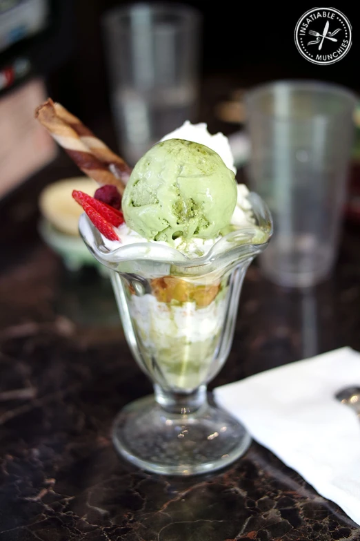 an ice cream and dessert sundae in a small glass dish