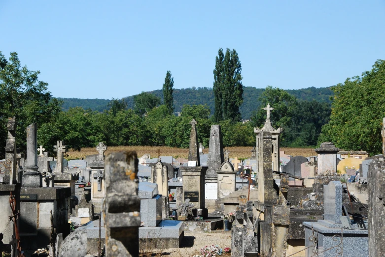 the large cemetery has many headstones at the cemetery