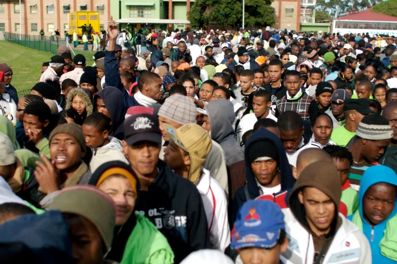 a large group of people standing in a field