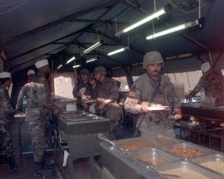 a group of soldiers preparing food in a warehouse