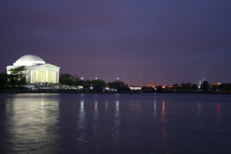 night view of the dome on a building across the water