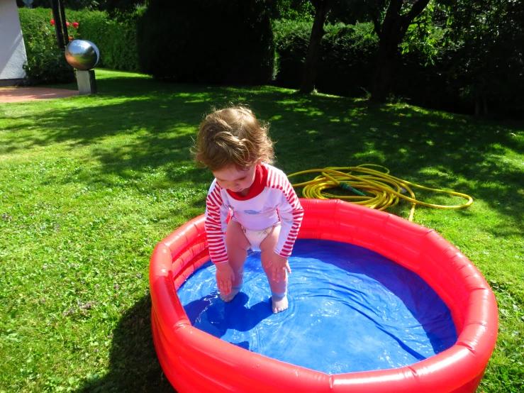 a  standing in a large pool