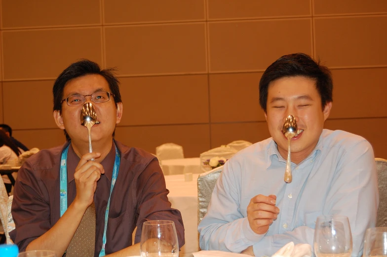 a couple of people sitting at a table