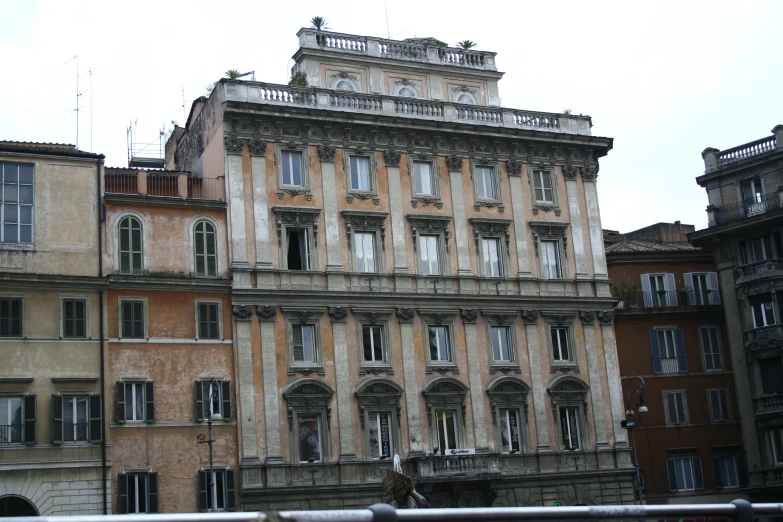 old, tan colored building in an urban area