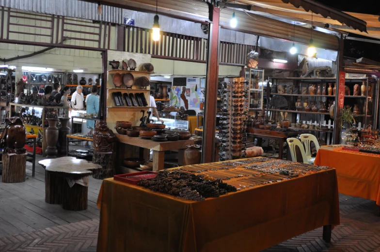 a room filled with wooden shelves and furniture