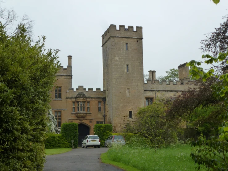 a large stone building with two towers and a gate