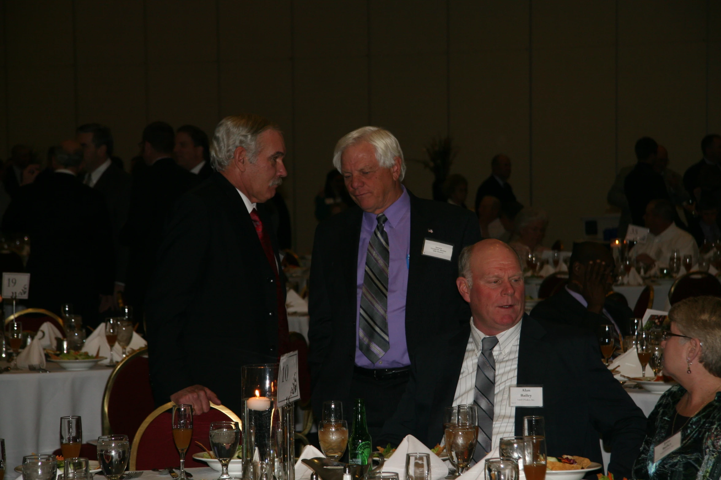 a few men who are sitting at a table