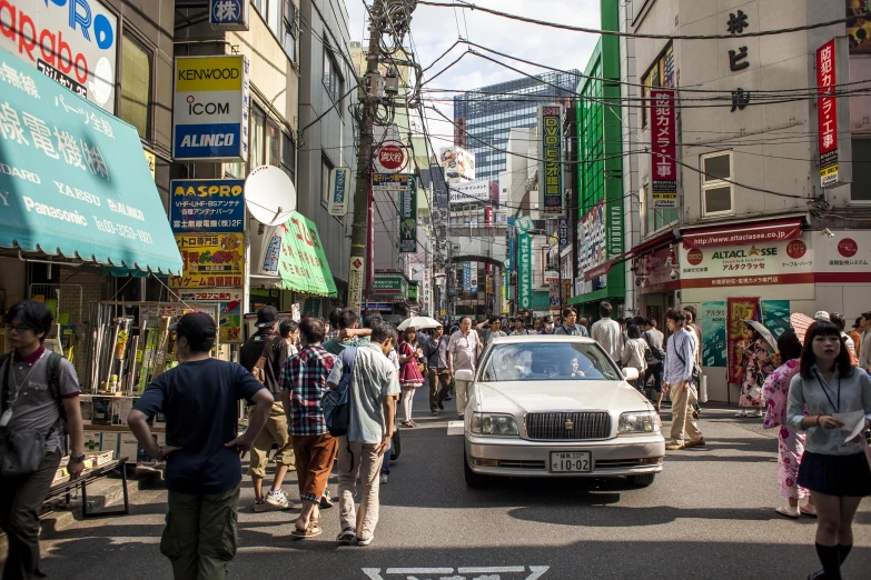 a street with people and cars on it