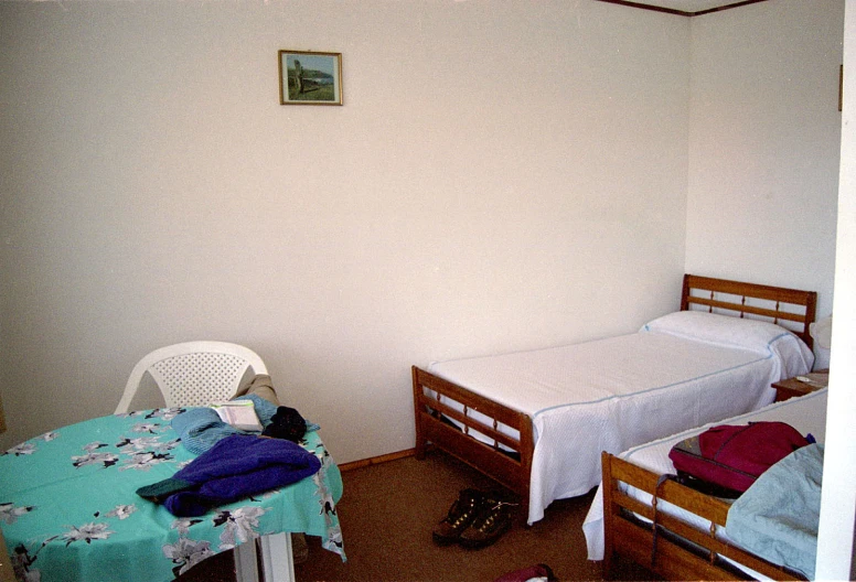 two small beds next to each other in a room