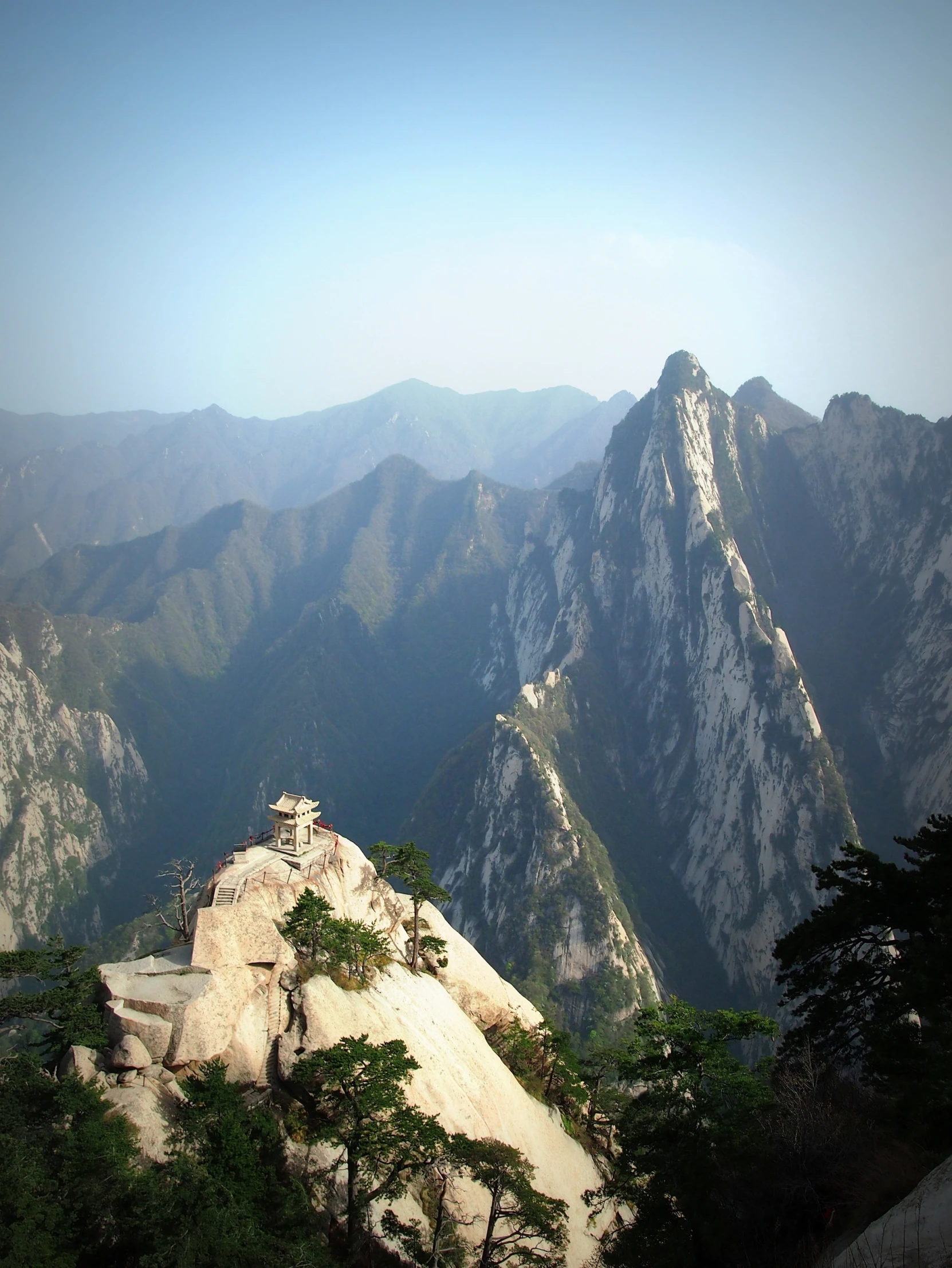 the rocks and vegetation in the foreground are almost as high as the mountains