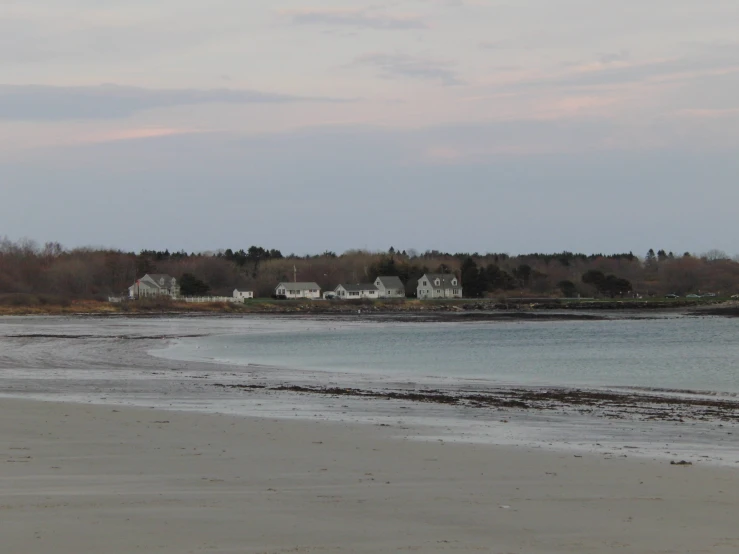 a scenic view of some houses by the water