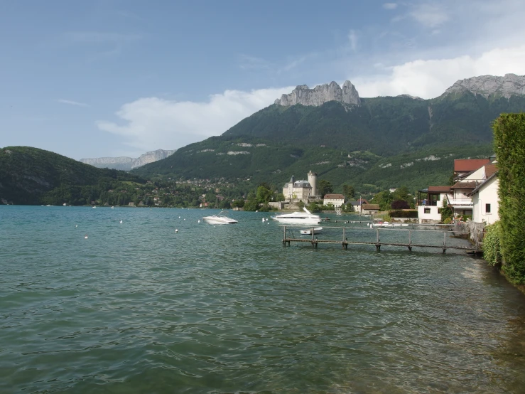 a body of water with boats and houses on it