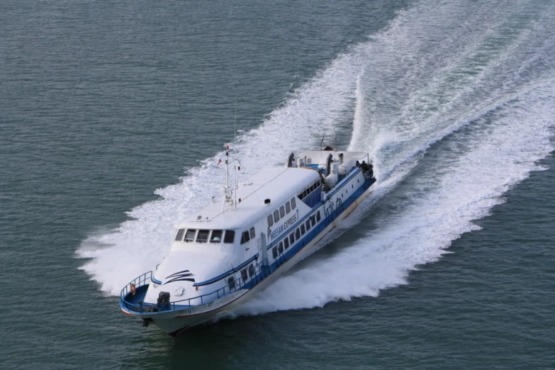 an aerial view of a passenger boat in the ocean