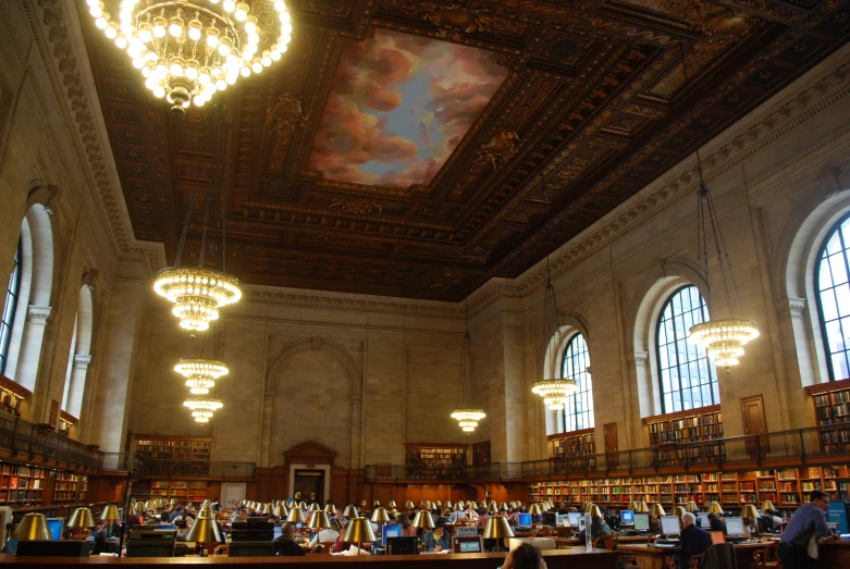 a room filled with a lot of books and a ceiling with a painting on it