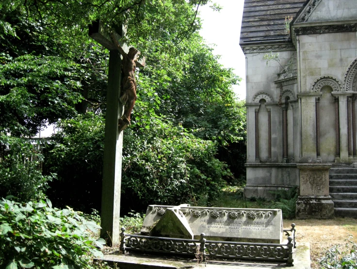 a view of a statue and tree from the bench