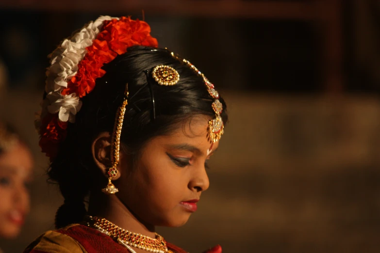 a  is dressed in indian garb and jewelry