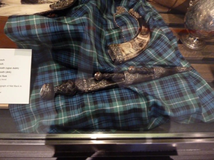 an assortment of clothing displayed in a case