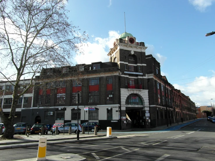 large old building located in the middle of the road