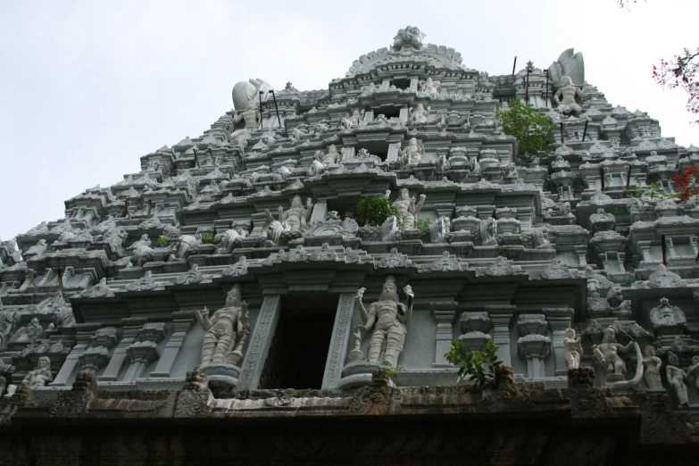 intricate carved indian buildings on the top of a hill