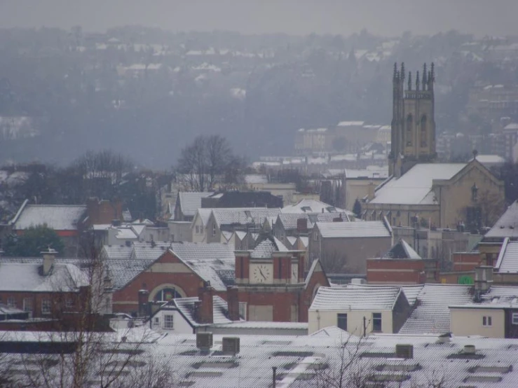 the view from above the snow covered rooftops of the city