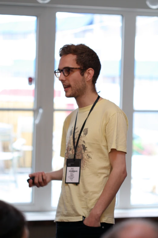 a person holding a small black object in his hands