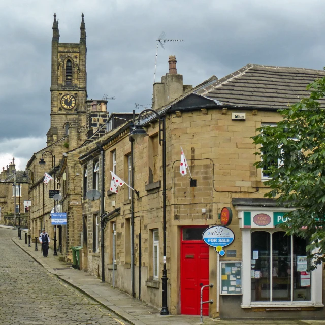 there are several buildings along the side of a street